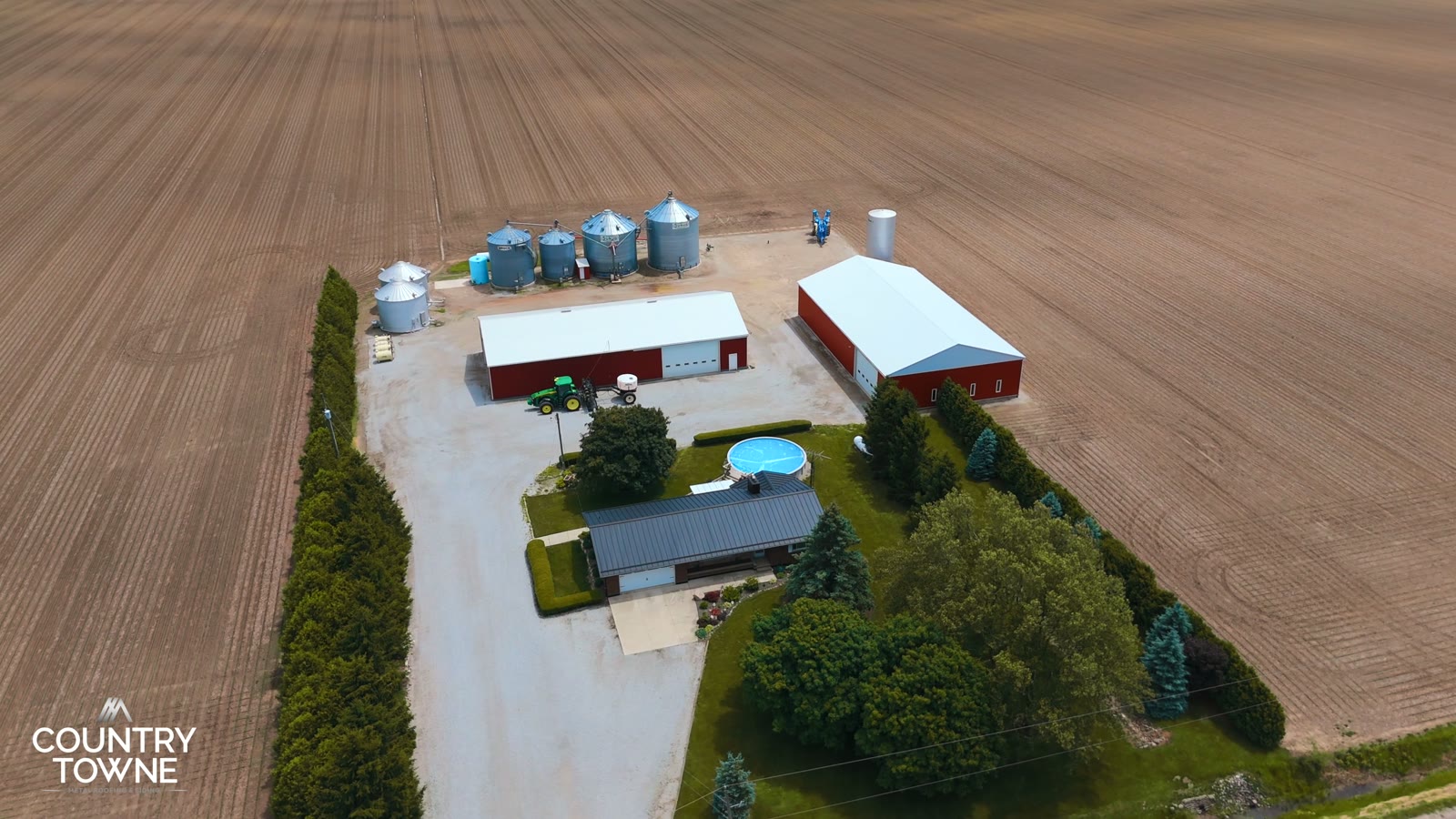 Aerial view of Scott Cook's home with a completed black standing-seam metal roof
