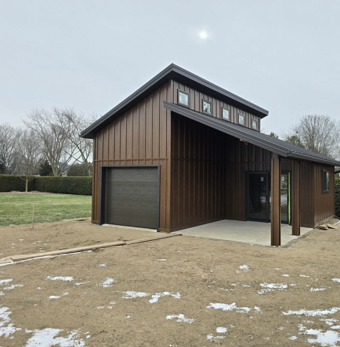 Finished Crown Rise Construction steel building with a dark metal roof and walls