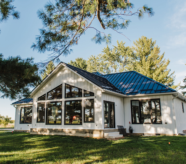 Home With Black Countrytowne Snaplock Roof and White Lock board Siding