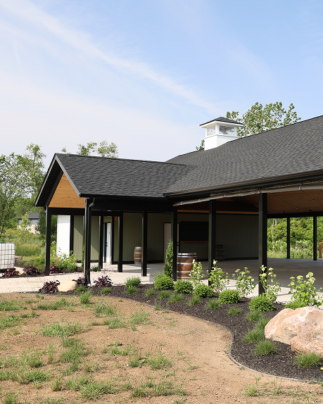 Sleek dark metal siding on contemporary Ontario building by Country Towne, offering cost-effective curb appeal