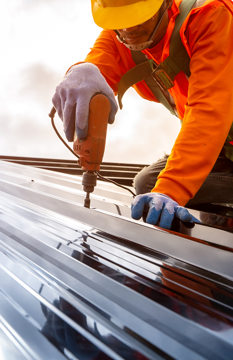 Worker Screwing down a revealed fastener panels