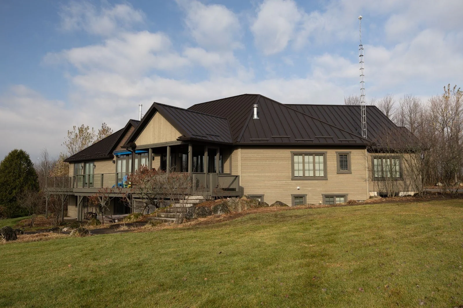 A big house with a metal roofing system.