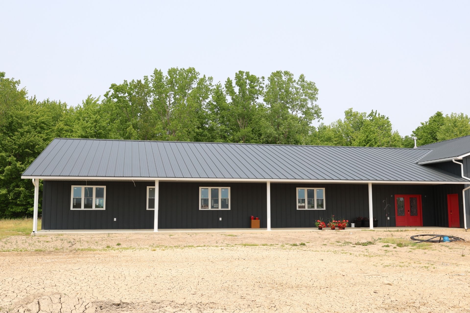 A commercial building with a smooth metal roof.